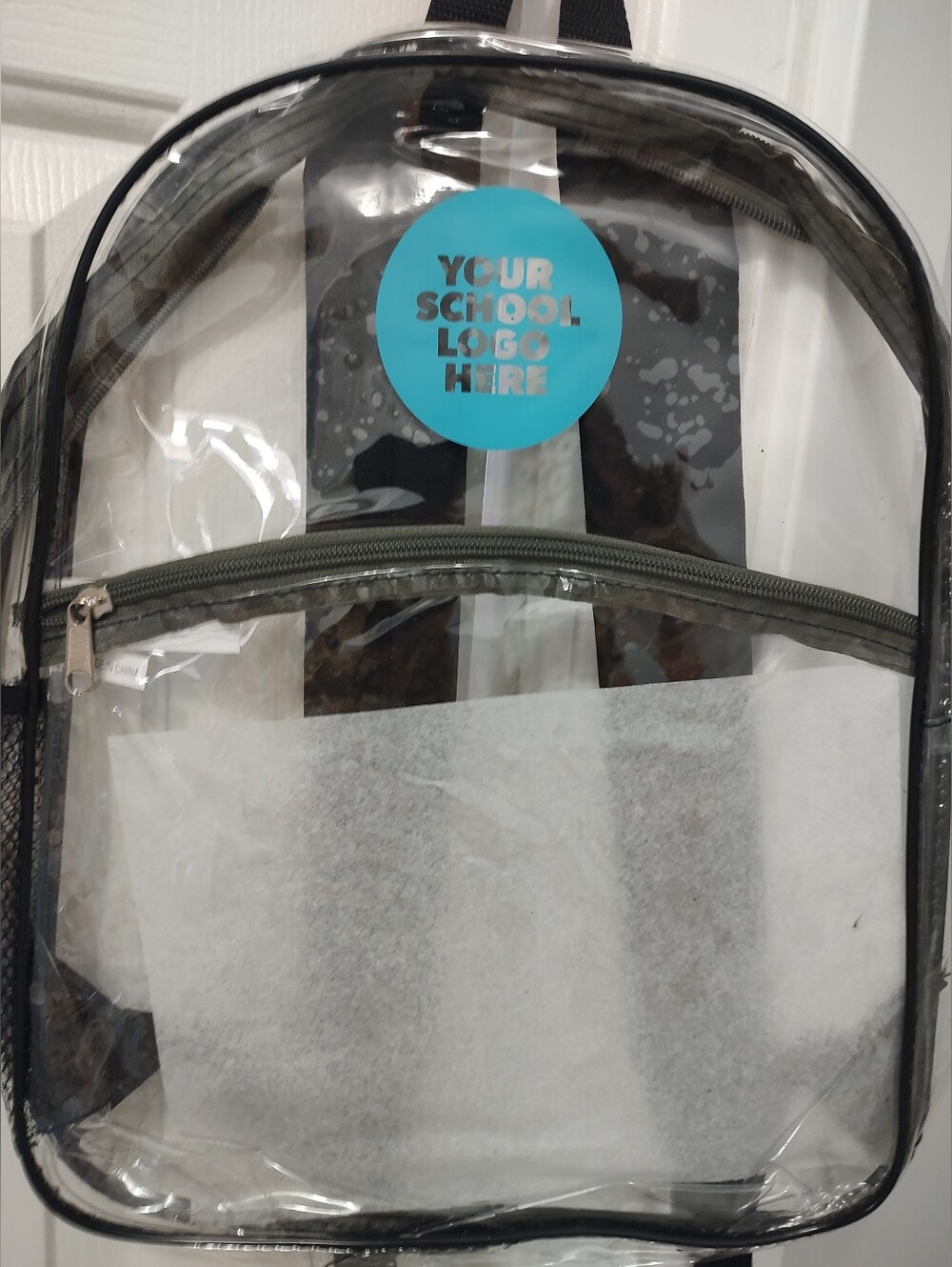 Clear backpack does have a spot with a blue circle that does not come off You co - Picture 2 of 3